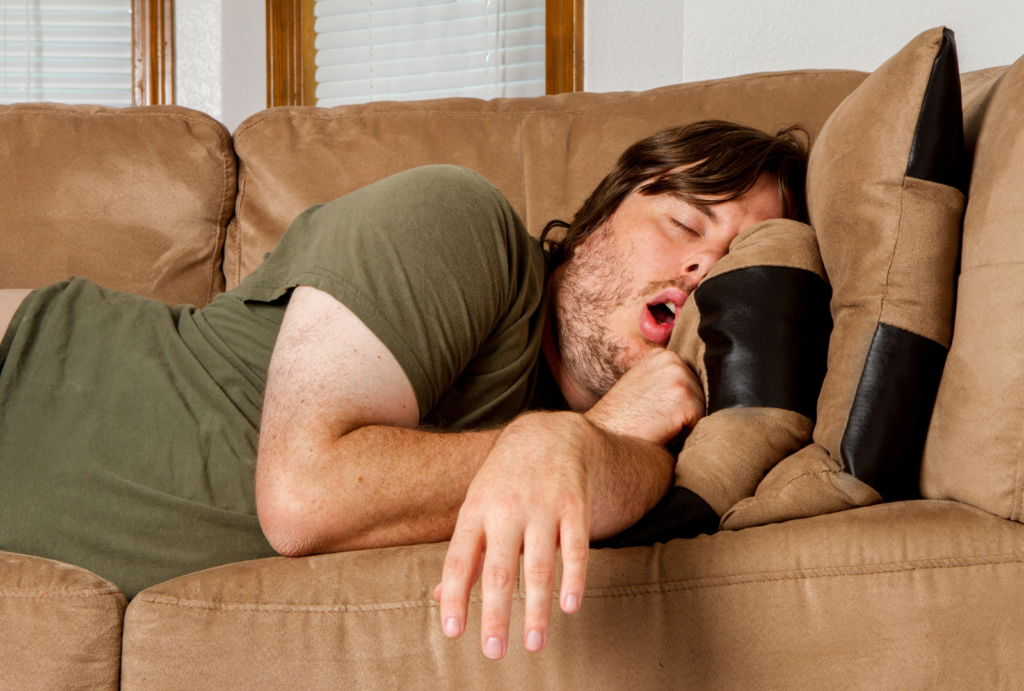 guy passed out on sofa